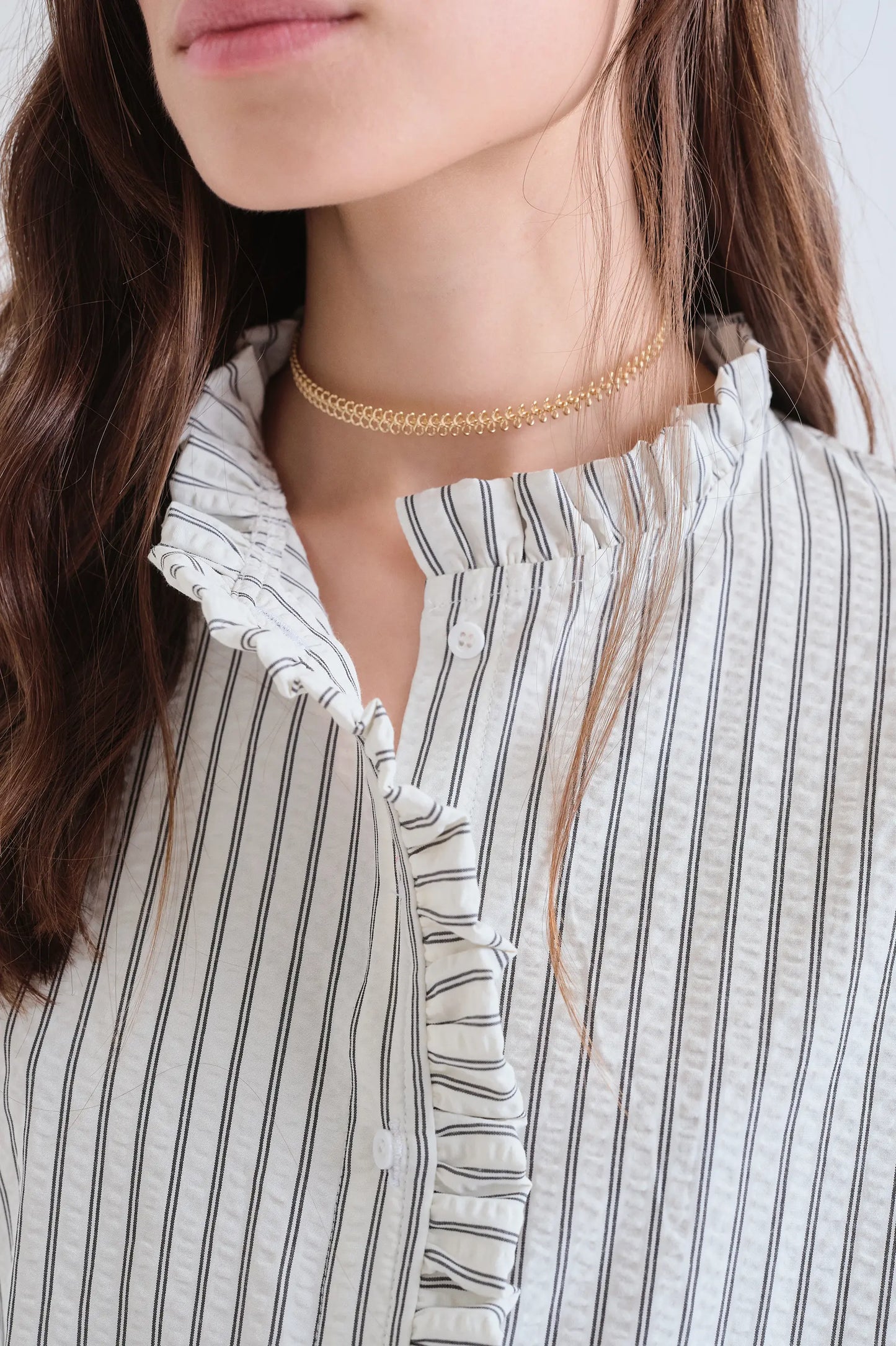 Black striped shirt with ruffle detail
