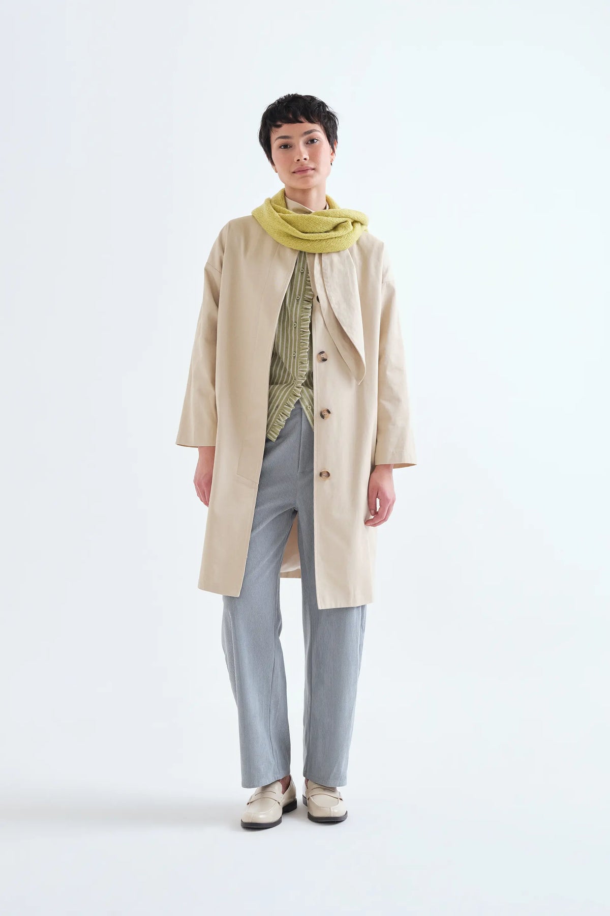 Light green striped shirt with ruffle detail