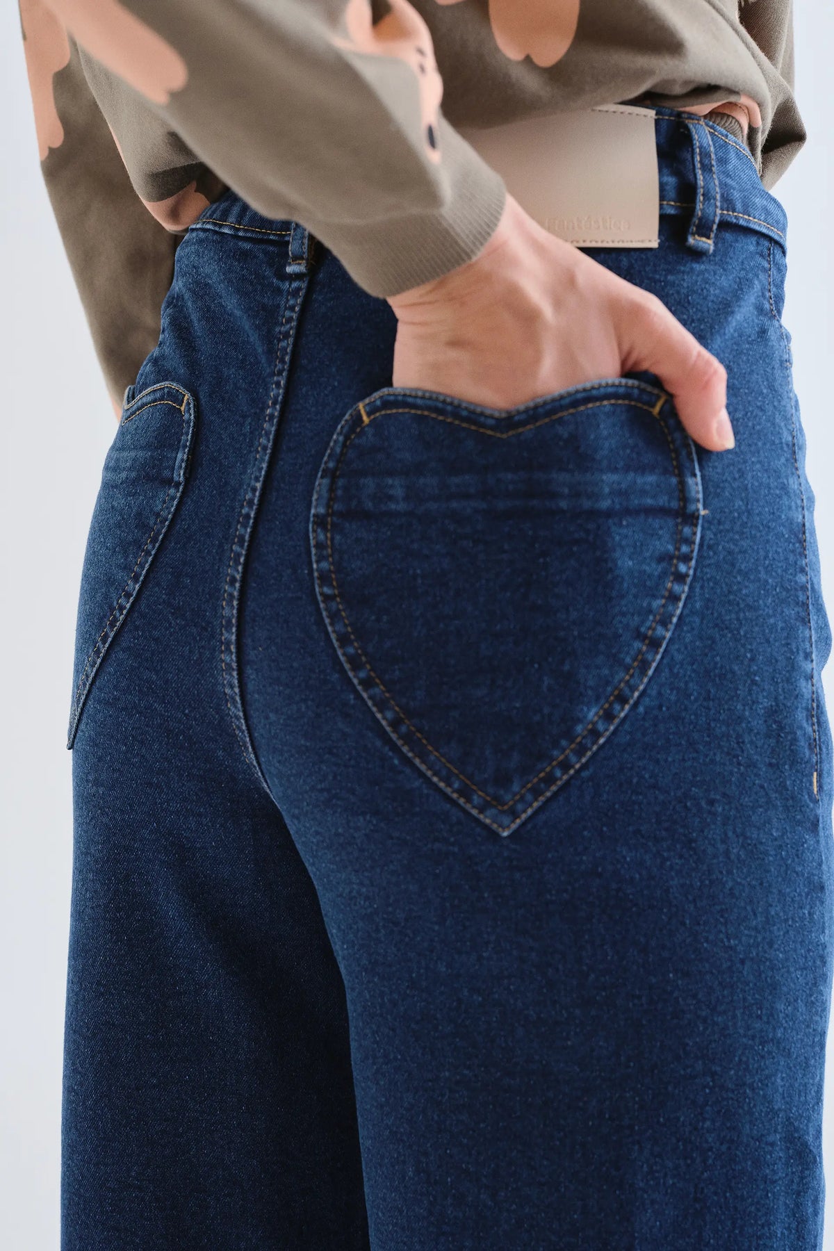 Navy blue jeans with heart pockets