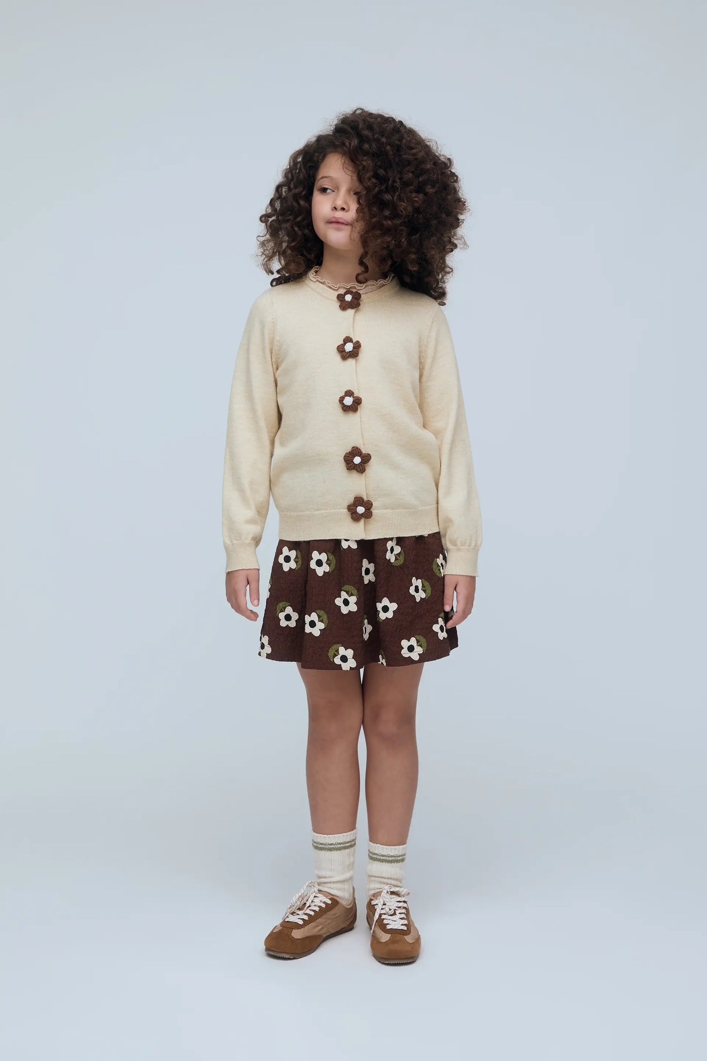 Off-white girl's cardigan with flower buttons